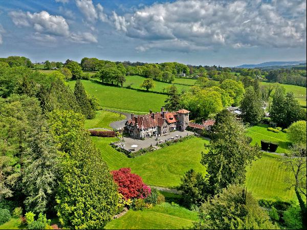 An outstanding Grade II listed Arts & Crafts Edwardian family home set centrally within pi