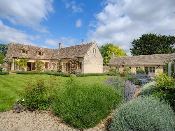 The Grange is a beautifully presented Cotswold stone village home with three bedrooms, a v