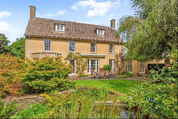 An extremely attractive edge of village country home with versatile outbuildings and spaci