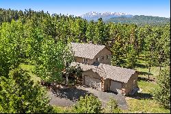 Stunning home nestled on .82 acres just minutes from Woodland Park