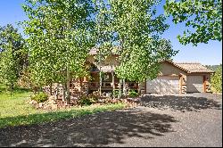 Stunning home nestled on .82 acres just minutes from Woodland Park