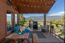 A special home in a private setting amongst the Pinon Pines and spacious 5 acres