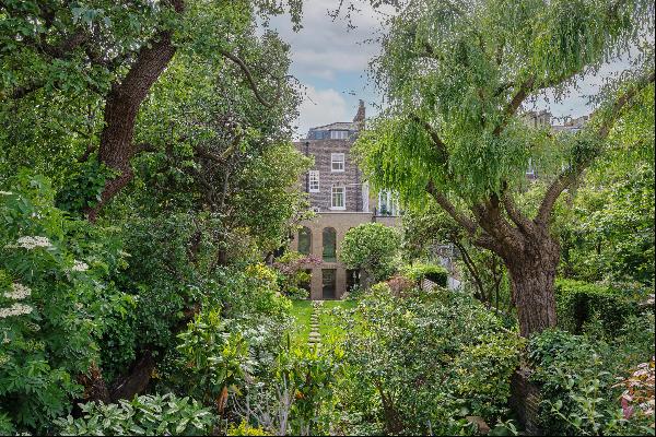 An exceptional Grade II listed Georgian freehold house, built in c1830, with a superb gard