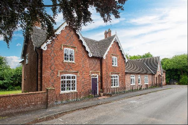 A recently refurbished, beautiful Grade II family home with an annexe, garaging and river 