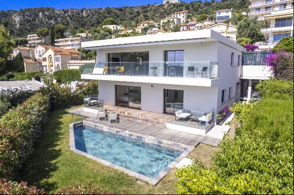 Contemporary villa with sea view and within walking distance of the beaches.