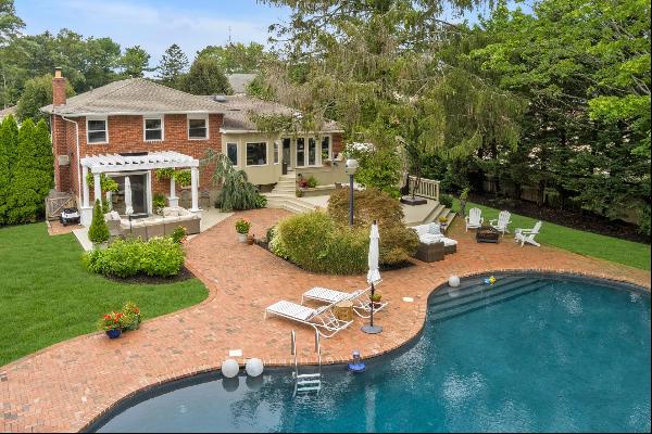 Welcome to your dream oasis in the heart of North Syosset! This unique and exquisitely upd