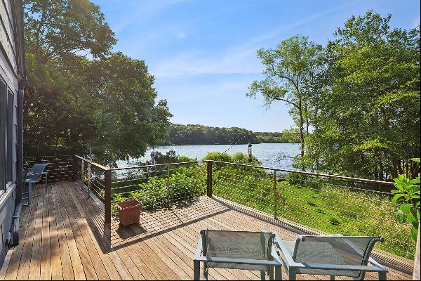 This exceptional waterfront property offers incredible views of Little Fresh Pond and a pr