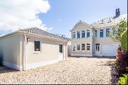 A substantial south facing beach house with superb sea views