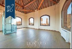 A Prestigious Icon in the Heart of Bologna: Renovated Historic Tower from the 1100s for Sa