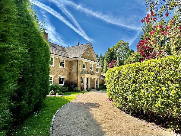 A stunning family home set in attractive mature gardens and situated a short distance from