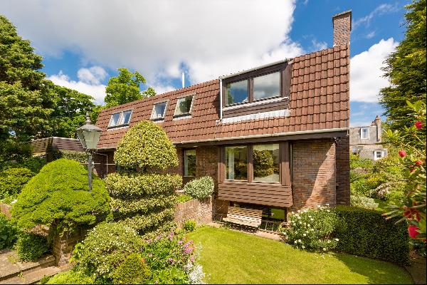 An impressive family home with private garden and garage in a prime Edinburgh address.