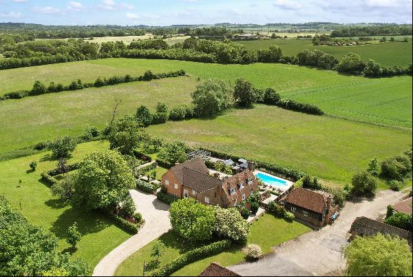 An impressive Grade II Listed farmhouse recently refurbished throughout with a two bedroom