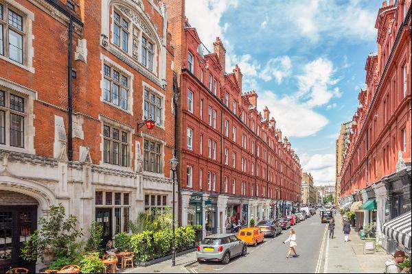 A charming apartment on the third floor of a sought-after red brick period building on one