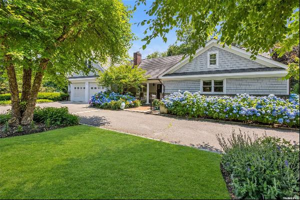 Welcome to this exquisite Cape Cod Sprawling Ranch located on the prestigious Duck Pond Ro