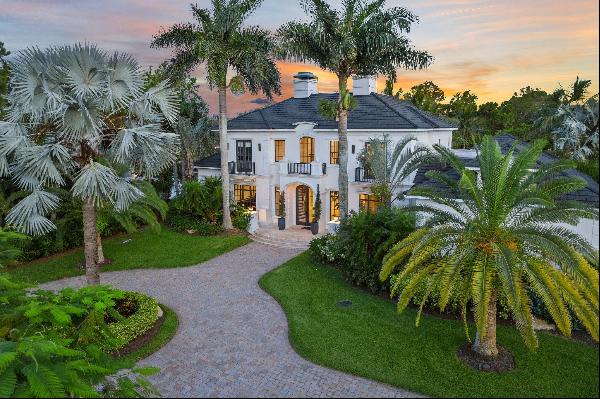 Welcome to 8082 SE Hidden Bridge Court! This beautiful estate home sits on 1-acre, boastin