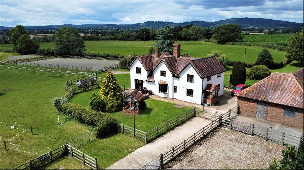 A superb 4 bedroom house occupying an elevated tranquil position surrounded by 9.5 acres o