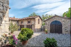 In the heart of Val Luretta, an ancient farmhouse surrounded by greenery