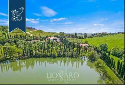 Prestigious farm with over 25 hectares of vineyards, olive trees, forests and a private la