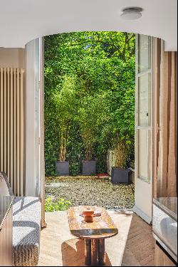 Garden level in a building with swimming pool.