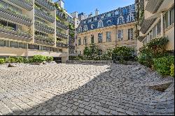 Garden level in a building with swimming pool.