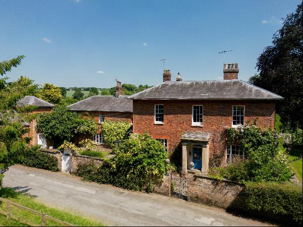 A magnificent family house set in attractive mature gardens and grounds, close to the cent