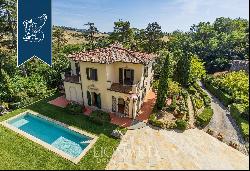 Exclusive estate with pool surrounded by Tuscany's leafy countryside