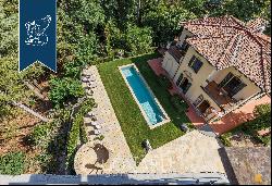 Exclusive estate with pool surrounded by Tuscany's leafy countryside