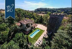 Exclusive estate with pool surrounded by Tuscany's leafy countryside