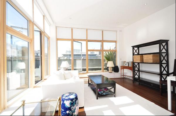 A large, one bedroom penthouse apartment with a private balcony in Islington