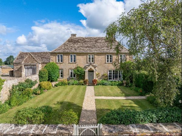A handsome Queen Anne farmhouse with a range of traditional stone barns, planning to exten