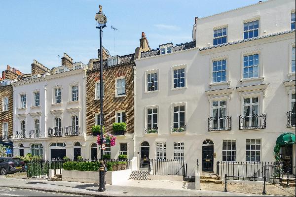 A white Stucco-fronted Freehold house for sale in Belgravia, recently refurbished and bene