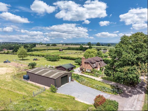 A well-presented, rural property with outbuildings situated within ten acres, and with goo