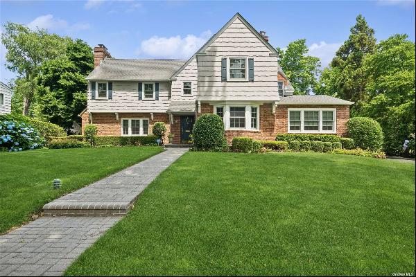 Welcome to this Colonial home nestled on a picturesque tree-lined street in the heart of t