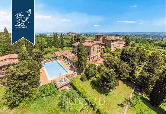 An Ancient Tuscan Farmhouse Transformed into a Luxury Hotel with Panoramic Views and Swimm