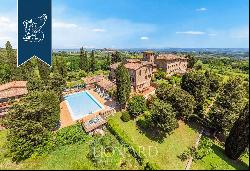 An Ancient Tuscan Farmhouse Transformed into a Luxury Hotel with Panoramic Views and Swimm