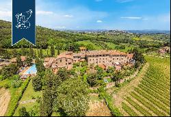 An Ancient Tuscan Farmhouse Transformed into a Luxury Hotel with Panoramic Views and Swimm