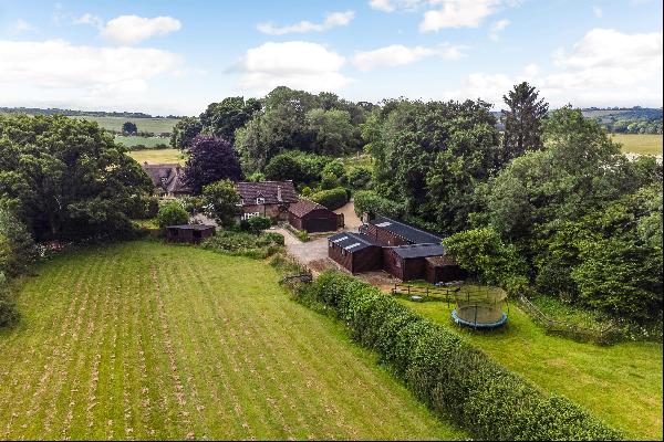 A well-presented home with versatile accommodation, land and stabling in a quiet, rural lo