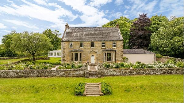 An exceptional Georgian country house with contemporary interiors in a secluded setting.