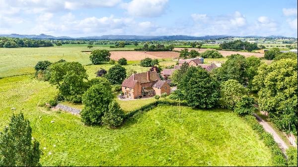 A delightful Grade ll listed village house standing in just over half an acre with grounds