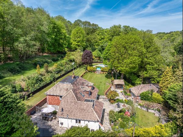 A superb family home in eight acres with a swimming pool and annexe in a rural yet commuta