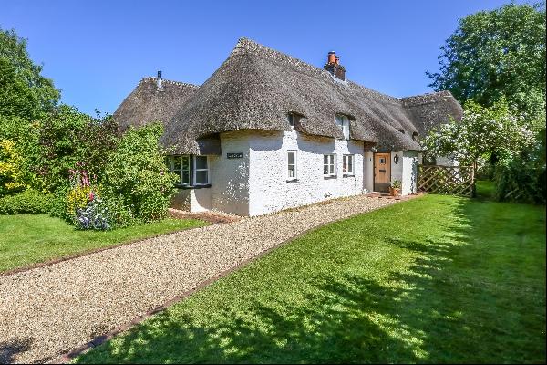 An attractive detached Grade II listed thatched cottage situated in the centre of the vill