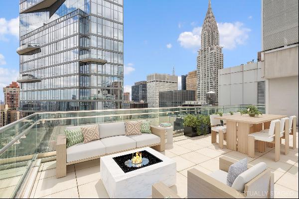 Introducing this distinctive duplex penthouse located in prime Midtown East Manhattan c