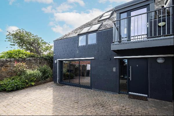 An exceptional architect designed detached family home which offers spacious and versatile