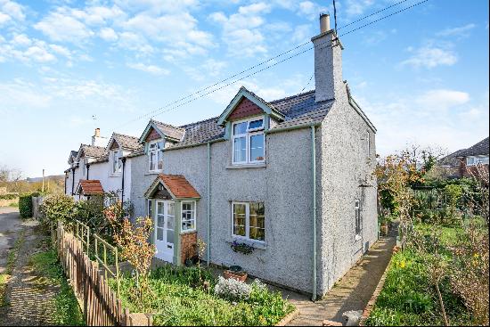 A semi-detached period cottage that offers great potential to extend and a large garden