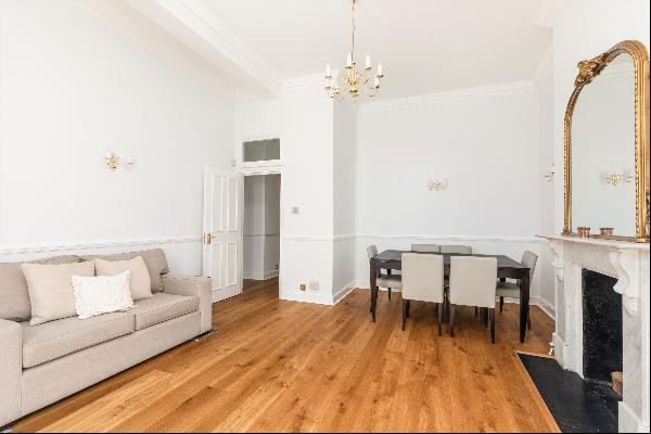 An impressive three bedroom lateral apartment for sale on Dover Street in prestigious Mayf