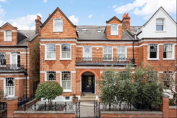 This remarkable seven-bedroom semi-detached family residence is positioned in the highly c