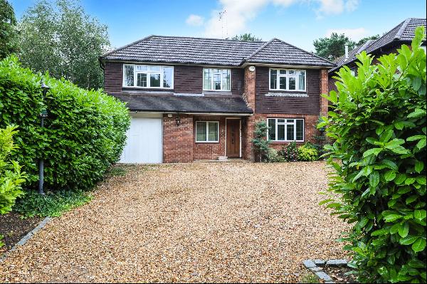 On a prestigious private road near Reed's School, this luminous and spacious family home f