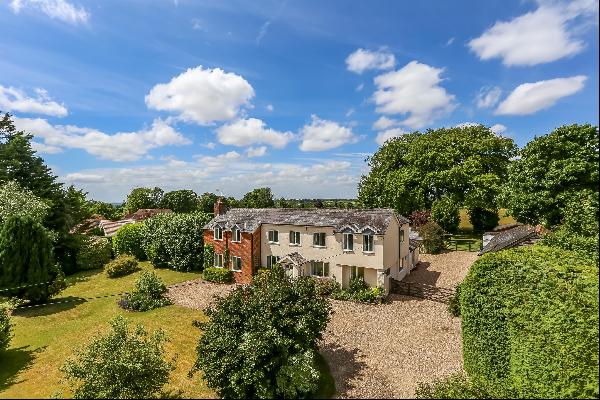 A detached house with stables and a barn located within the countryside village of Medstea