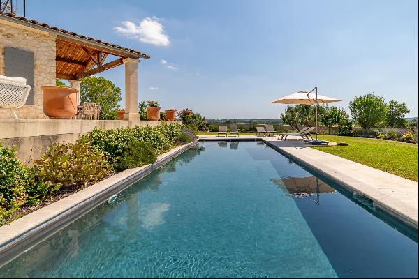 A contemporary Provencal-style rural home in a commanding position near to Uzes.