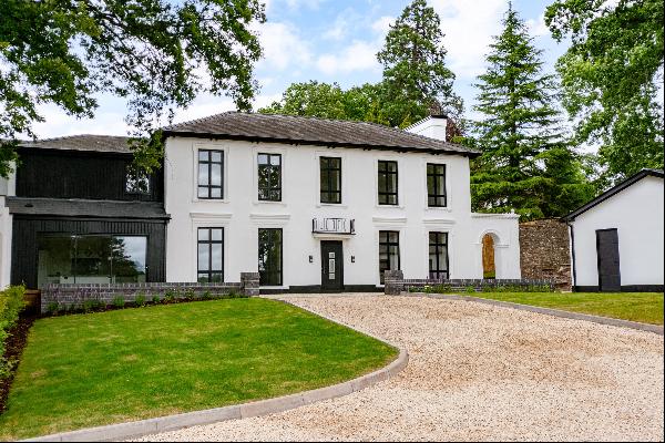 An exceptional five bedroom family home with far reaching views and extensive gardens and 